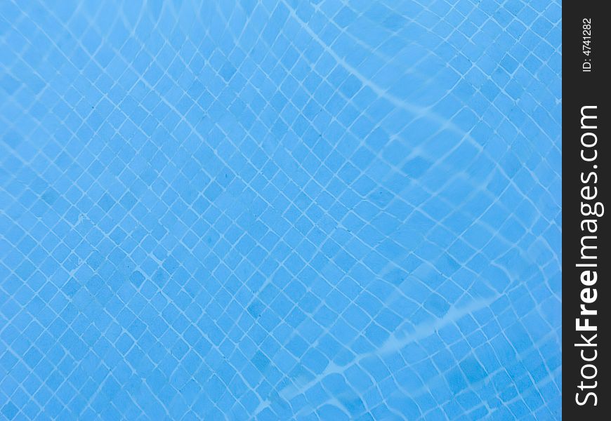 Abstract image of blue water in the swimming pool