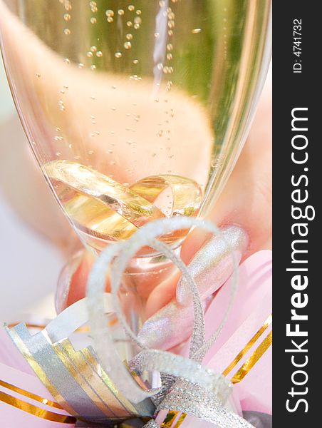 Two wedding ring in the glass of champagne. Two wedding ring in the glass of champagne