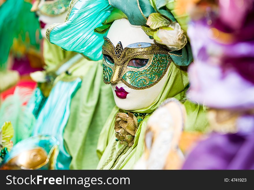 Green and gold costume at the Venice Carnival. Green and gold costume at the Venice Carnival