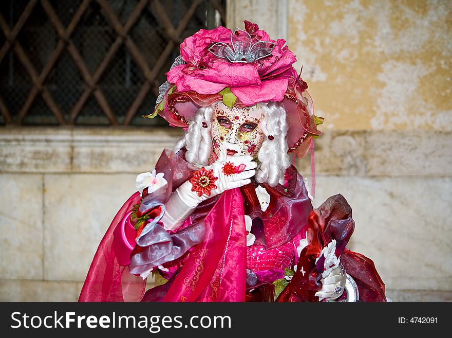 A pink rose mask at the Venice Carnival