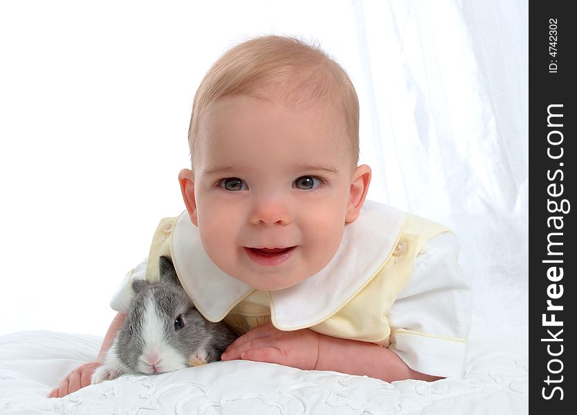 Baby boy with gray bunny. Baby boy with gray bunny