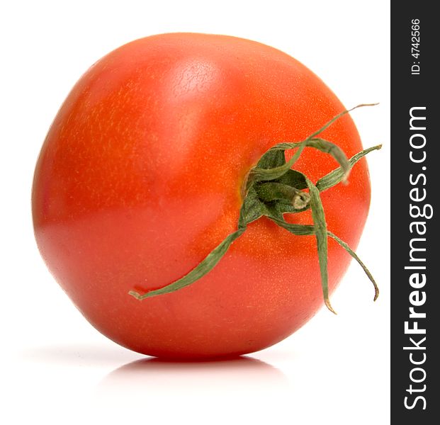 Perfect tomato on the white. Full isolation, shallow DOF.