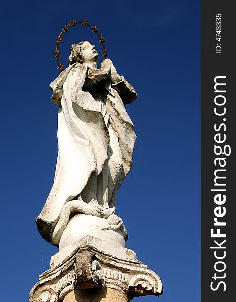 Holy Mother statue over a blue sky. Holy Mother statue over a blue sky