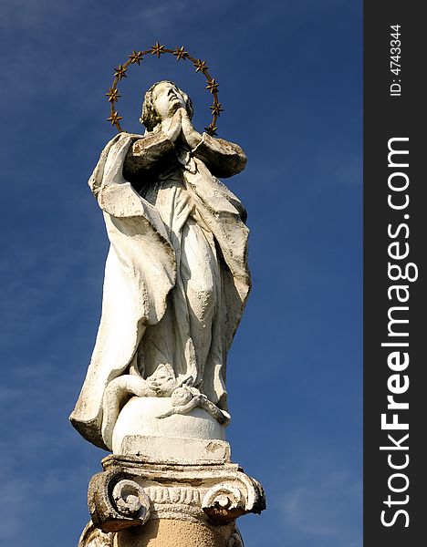 Holy Mother statue over a blue sky. Holy Mother statue over a blue sky