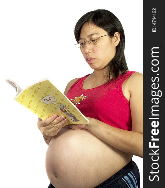 A pregnant women read a book with white background. A pregnant women read a book with white background