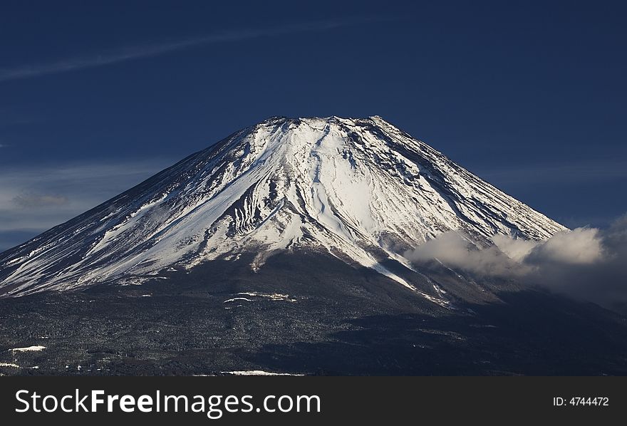 Morning sun illuminating the peak of Mount Fuji on a clear Winter's day. Morning sun illuminating the peak of Mount Fuji on a clear Winter's day