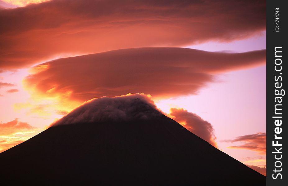 A fiery sunrise over the silhouette of sacred Fuji. A fiery sunrise over the silhouette of sacred Fuji