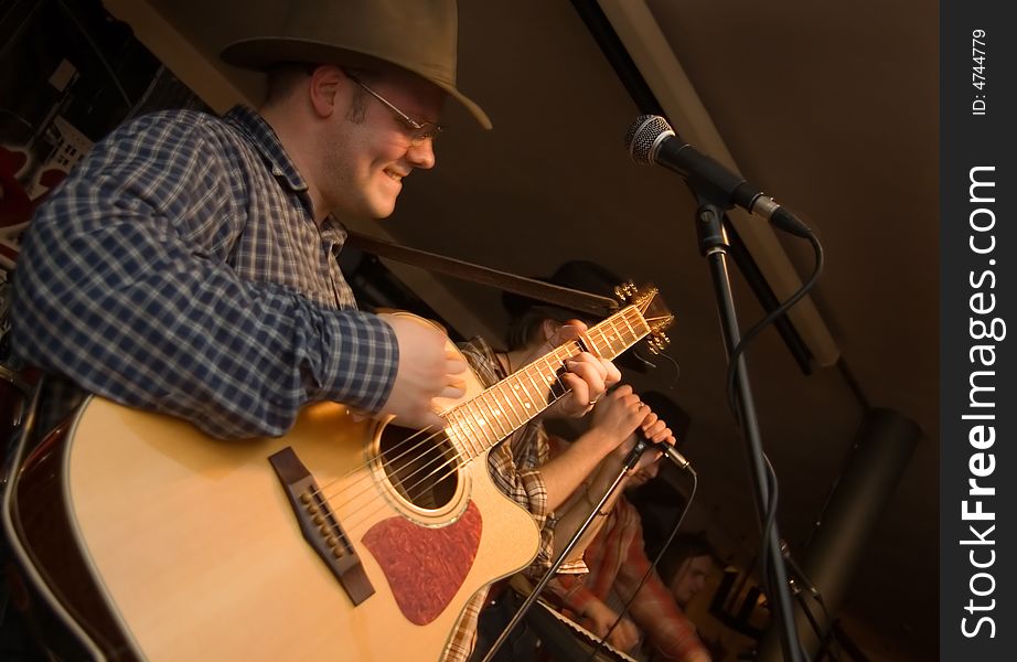 Musician With A Guitar.