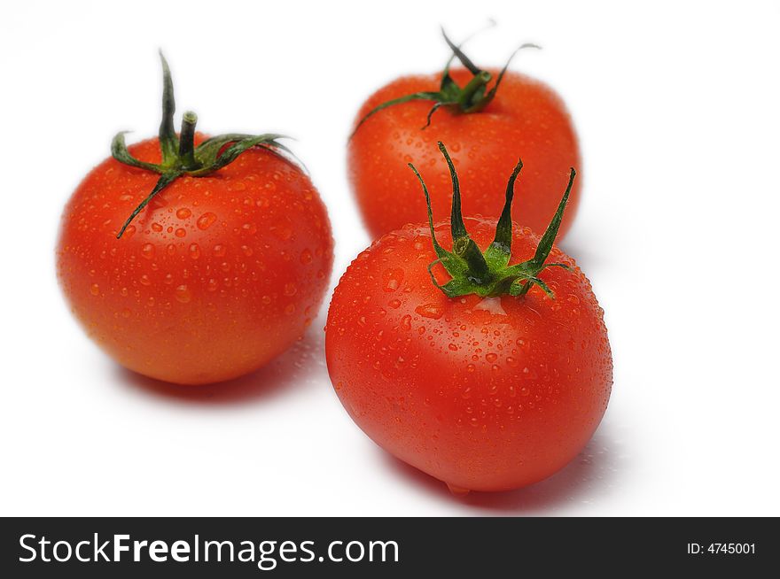 Fresh three tomato isolated on white background