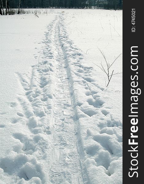 White winter snow road with tracks, Russia