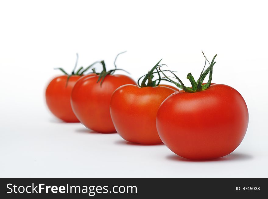 Fresh four tomato isolated on white background