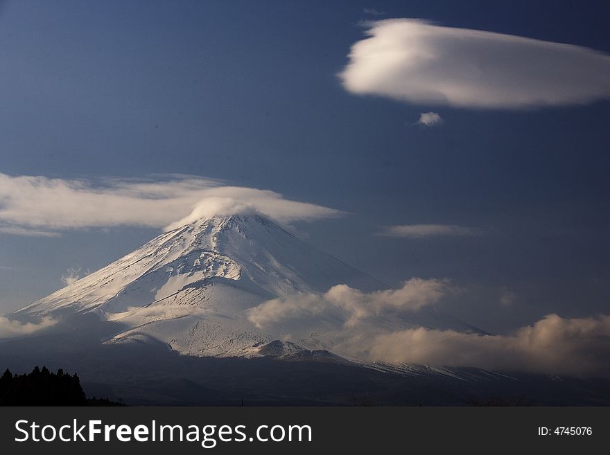 Mount Fuji enshrouded in clouds. Mount Fuji enshrouded in clouds