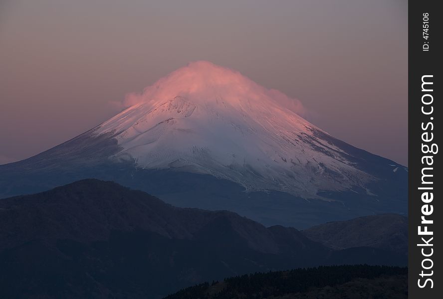 The Sacred Fuji in winter as a view from moutain peak. The Sacred Fuji in winter as a view from moutain peak