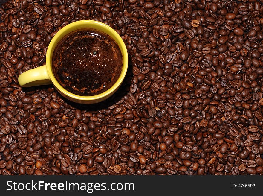 Coffee cup standing on coffee beans. Coffee cup standing on coffee beans
