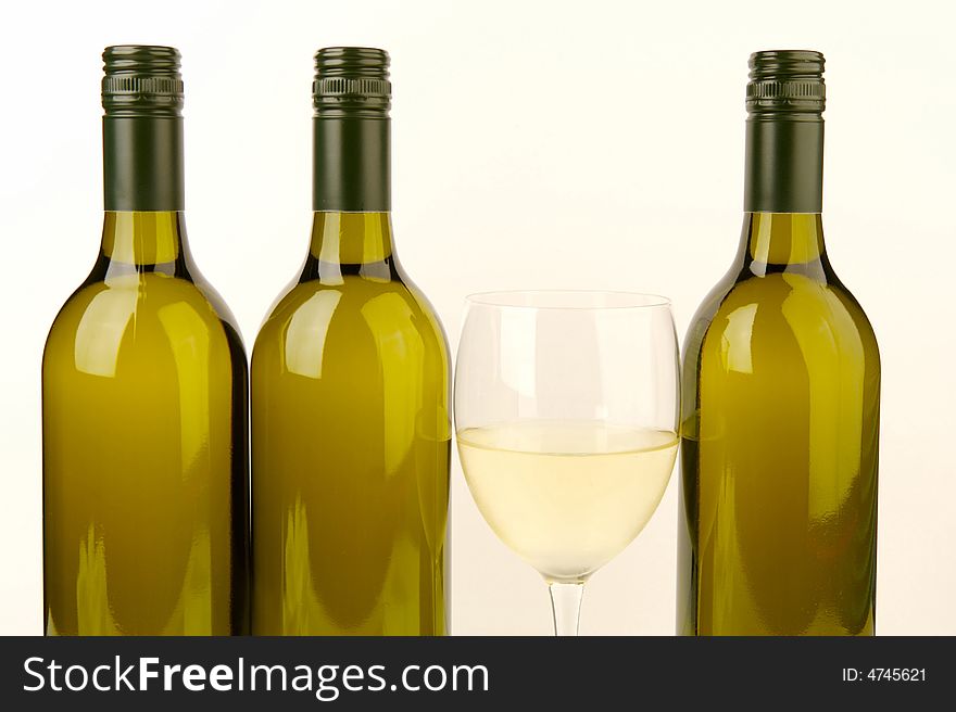 White wine bottles isolated against a white background