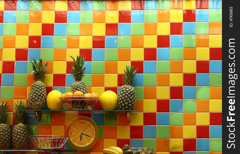 Colorful wall with a clock and fruit. Colorful wall with a clock and fruit