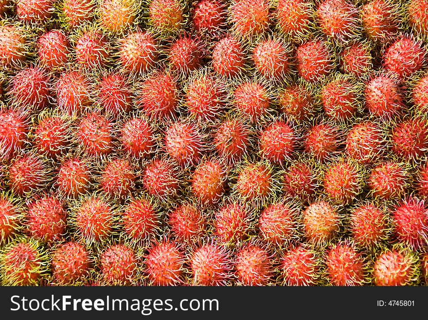 A big pile of rambutan fruit for sale