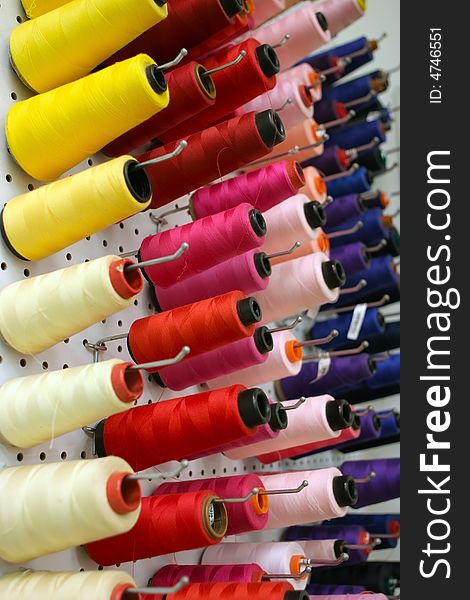 An image of a bunch of colorful cotton bobbins