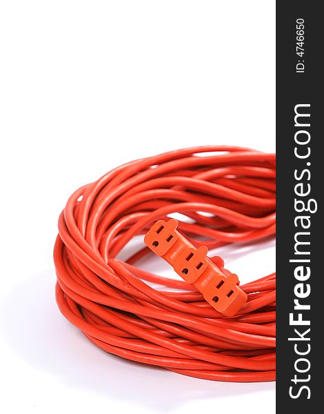 A 100 foot orange extension cord coiled up with a three way splitter