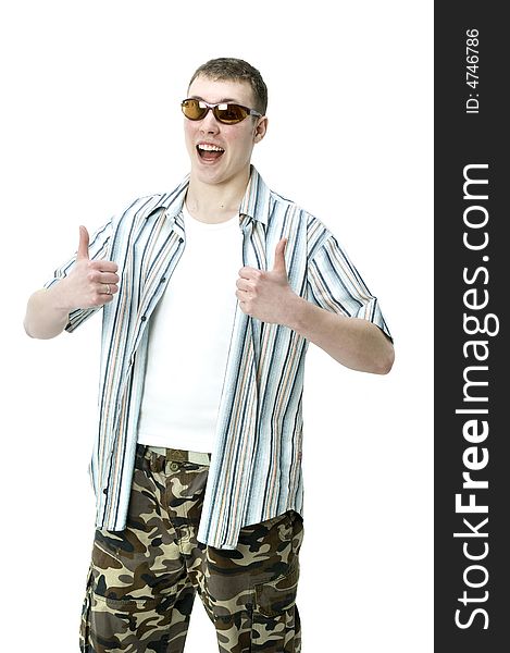 A good-looking young male in summer gear giving a thumbsup. A good-looking young male in summer gear giving a thumbsup