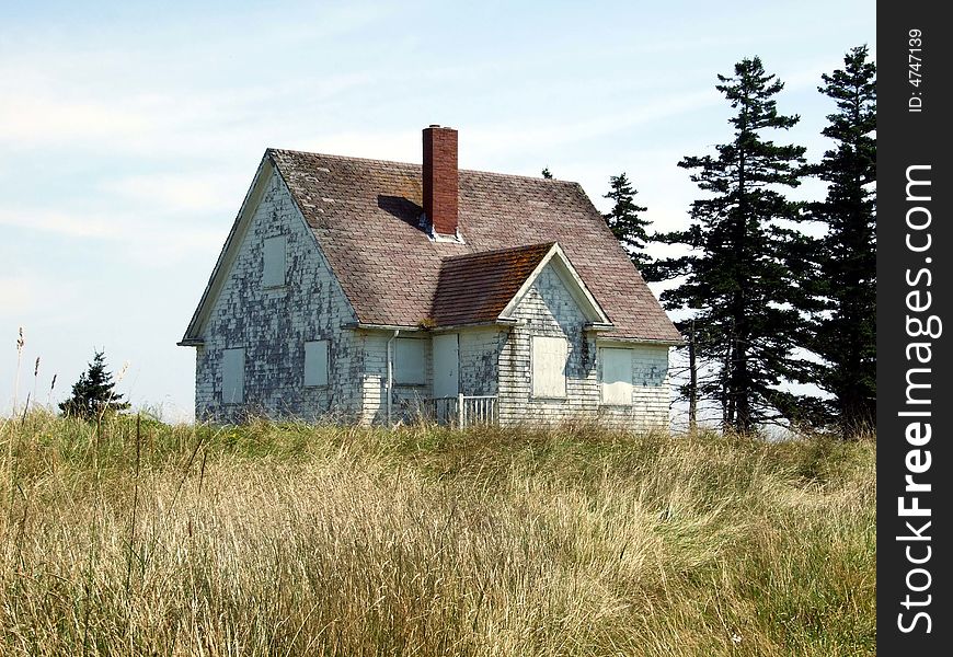 Old abandoned boarded up house, on Moshers Island Lighthouse Lahave Lunenburg County Nova Scotia Canada. Old abandoned boarded up house, on Moshers Island Lighthouse Lahave Lunenburg County Nova Scotia Canada