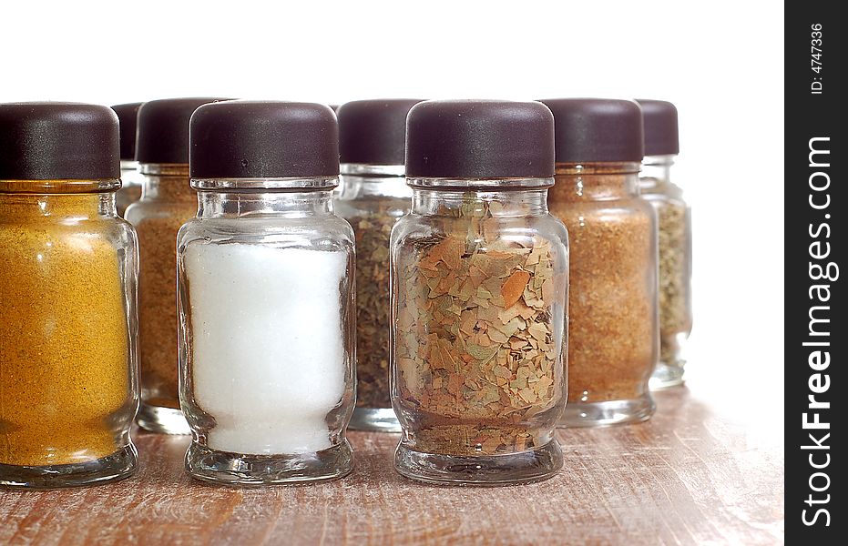 Variety of spices in bottles high resolution image