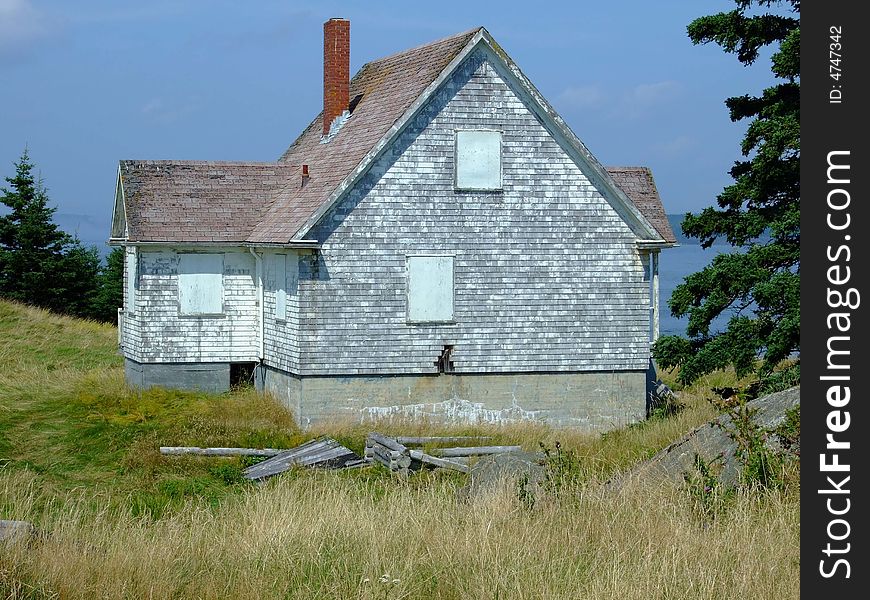Old abandoned boarded up house, on Moshers Island Lighthouse Lahave Lunenburg County Nova Scotia Canada. Old abandoned boarded up house, on Moshers Island Lighthouse Lahave Lunenburg County Nova Scotia Canada