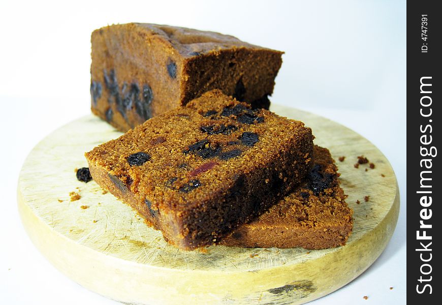 A delicious fruits cake on a cutting board