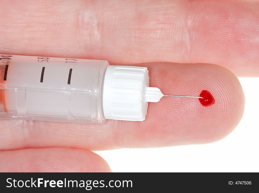 Finger with blood drop and insulin injector