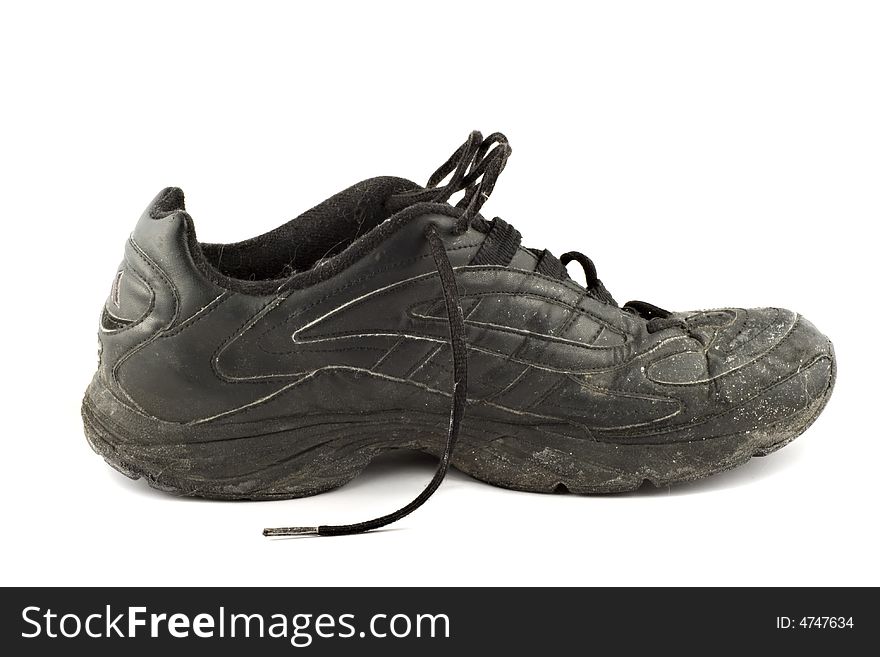 Old grungy Running Shoes isolated on white background