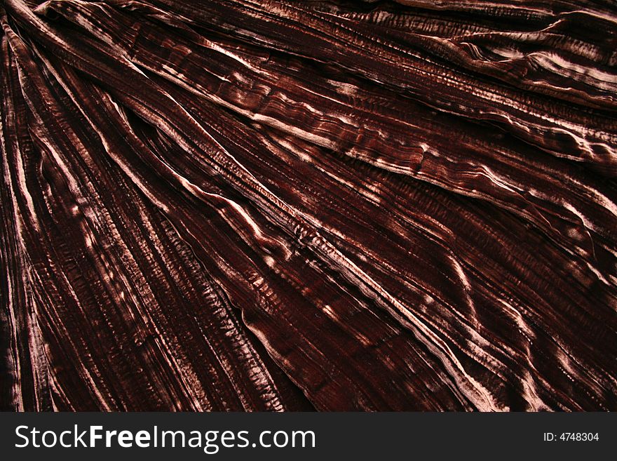 Pleated brown velvet for backgrounds. Tucks runs diagonally.