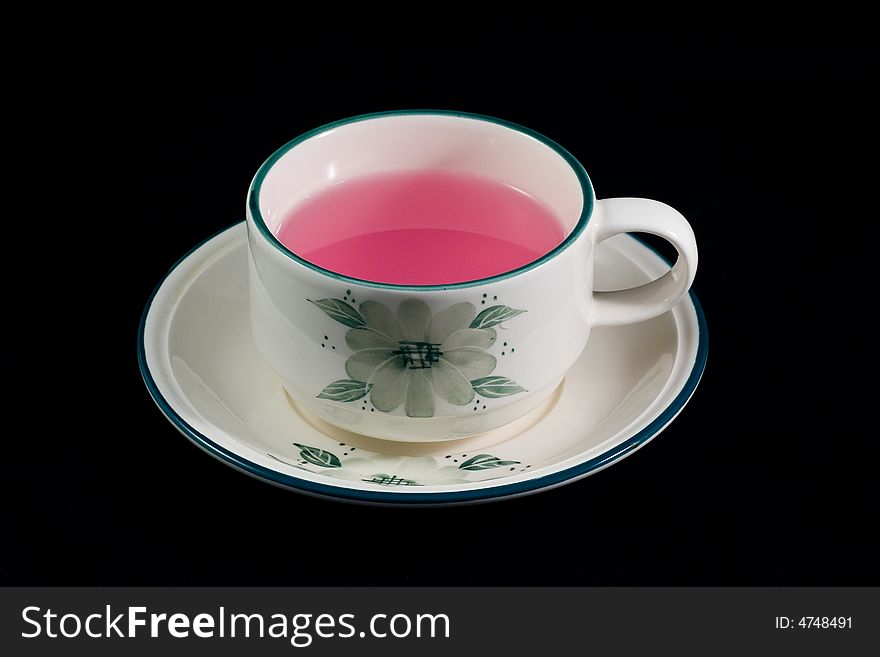 A cup of tea which made from strawberry. A cup of tea which made from strawberry