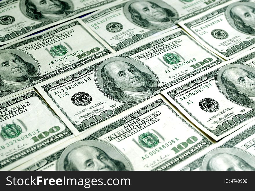 Closeup of several hundred dollar bills isolated on white background. Closeup of several hundred dollar bills isolated on white background