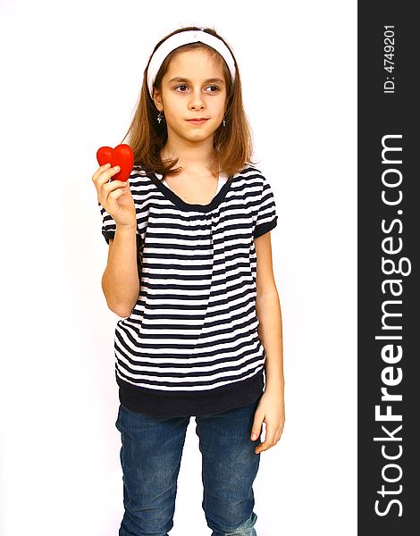 Little girl holding a valentine heart