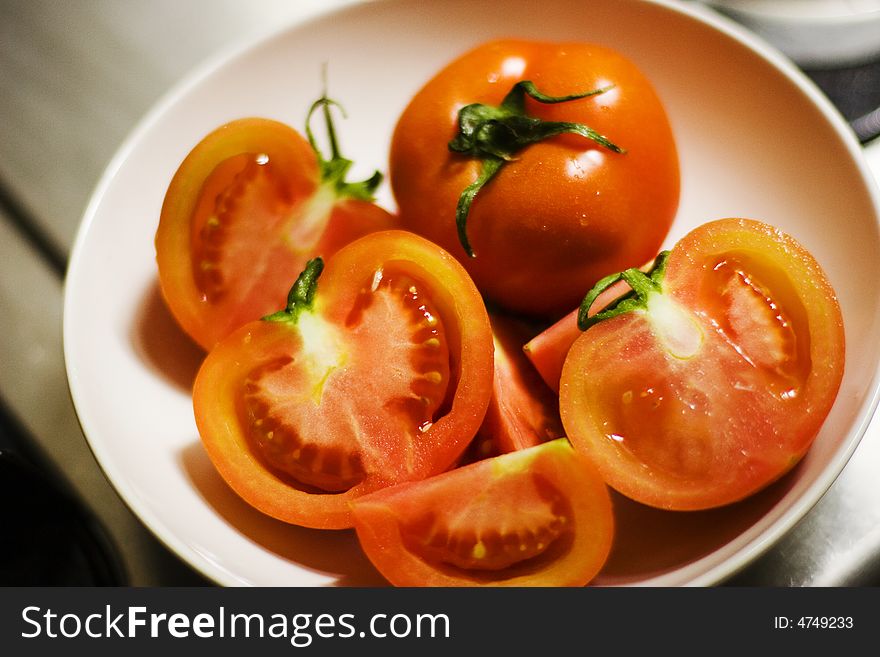 Some tomato on the plate. Some tomato on the plate