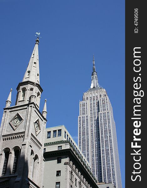 Church steeple and Empire State Building. Church steeple and Empire State Building.