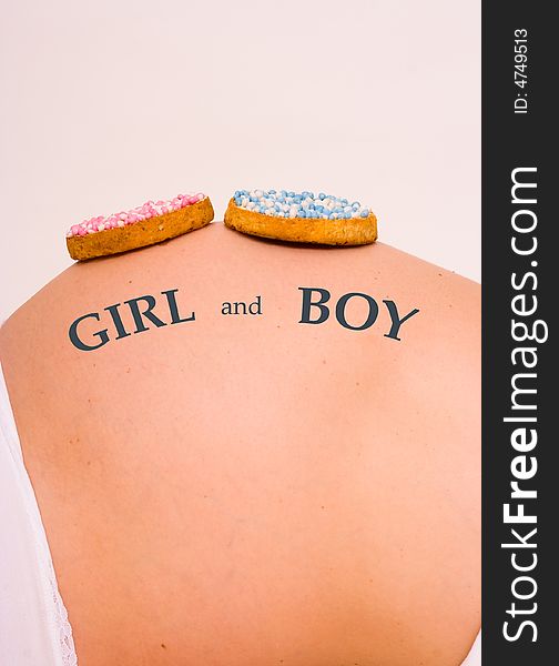 2 biscuits on belly. It is t a boy and a girl. 2 biscuits on belly. It is t a boy and a girl