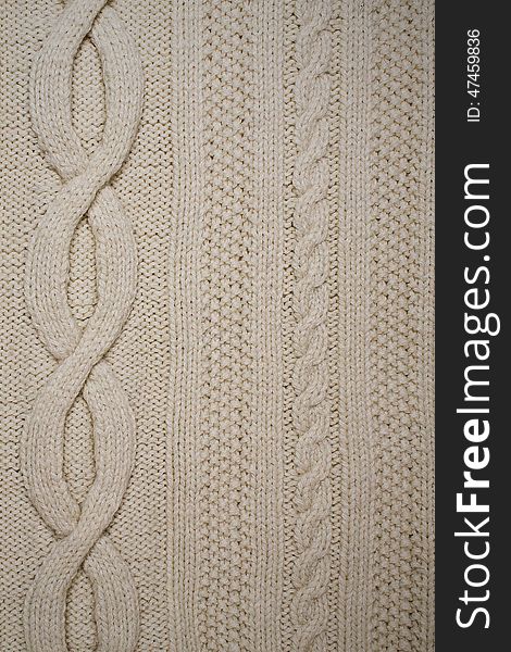 Texture of white knitted fabric with patterns. Texture of white knitted fabric with patterns