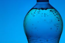 Mineral Water Bottle On Blue Background Royalty Free Stock Image