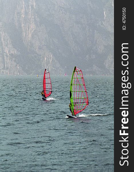 Two wind surfers on Lake Garda, Italy. Two wind surfers on Lake Garda, Italy.