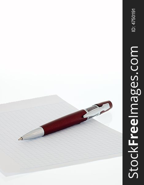 Red ball pen and notebook into check. Red ball pen and notebook into check