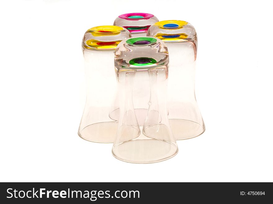 Four glasses with colored bottoms