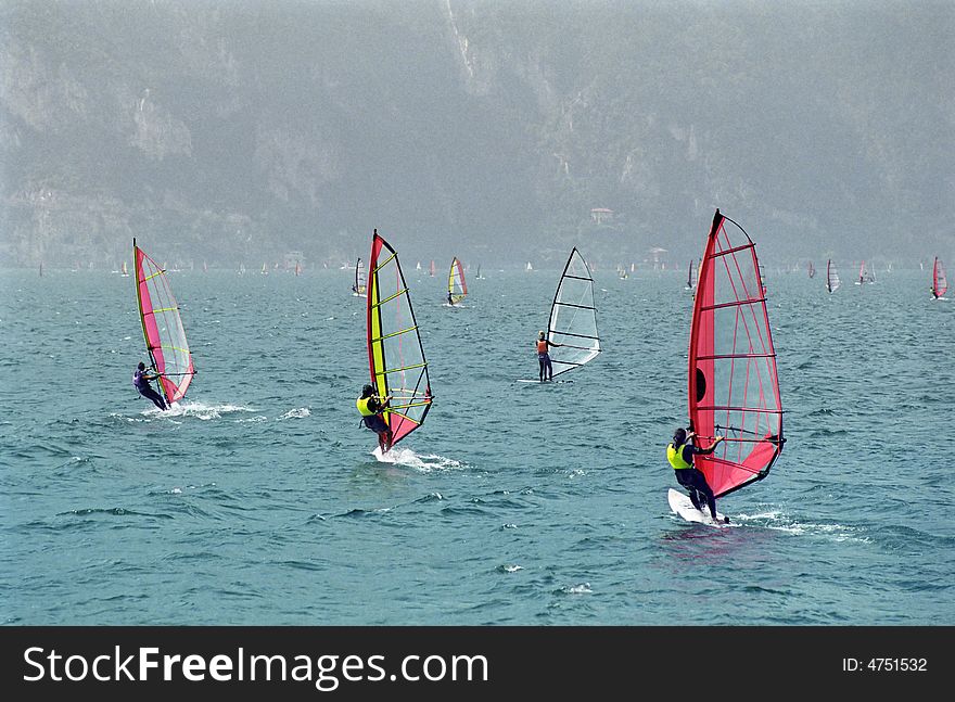 Tree wind surfers racing on Lake Garda, Italy. Tree wind surfers racing on Lake Garda, Italy.