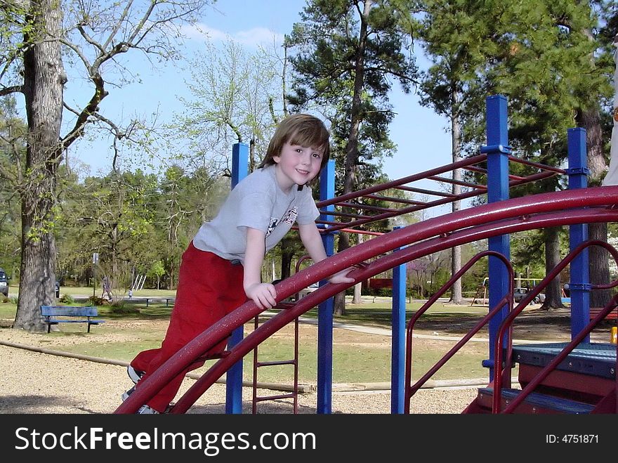 Boy playing in park on sunny day. Boy playing in park on sunny day