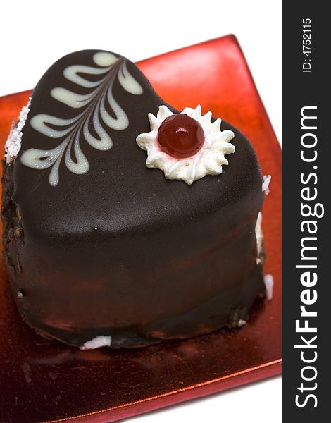 Chocolate cake on red plate
