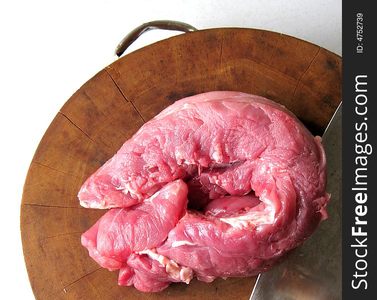 A top view of the pork meat on cutting board