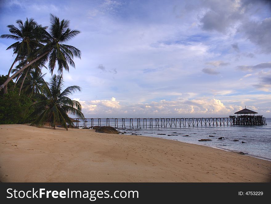 A perfect beach with a beautiful restaurant way out in the ocean. A perfect beach with a beautiful restaurant way out in the ocean.