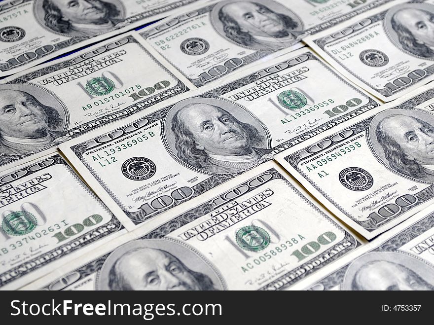 Closeup of several hundred dollar bills isolated on white background. Closeup of several hundred dollar bills isolated on white background