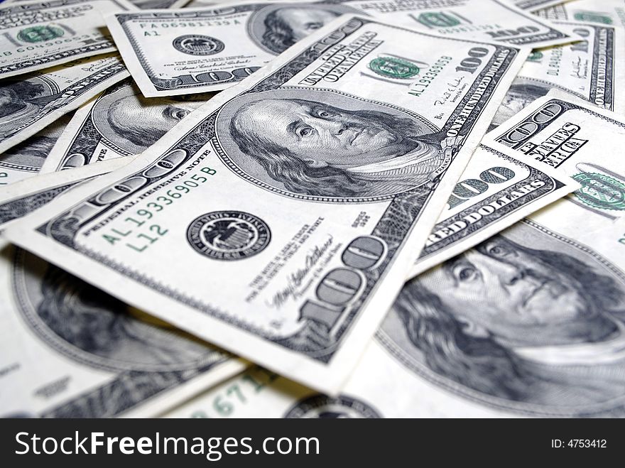 Closeup of several hundred dollar bills isolated on white background. Closeup of several hundred dollar bills isolated on white background