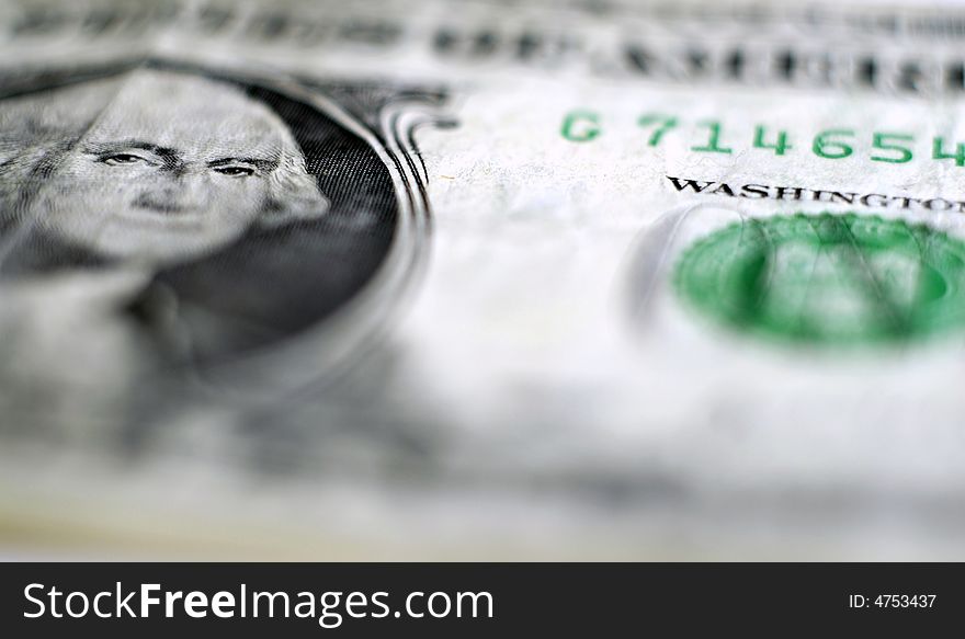 Closeup of one dollar bill focused on George Washington's face. Closeup of one dollar bill focused on George Washington's face
